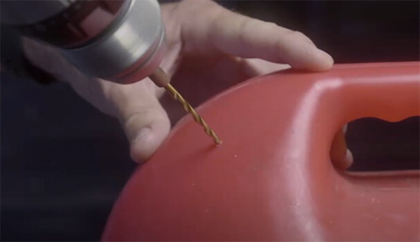 EZ Pour drilling a hole in the back of a gas can